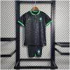 Kids World Cup Brazil Leopard Black Kit 2022 on hanger showing black jersey and shorts with neon green trims
