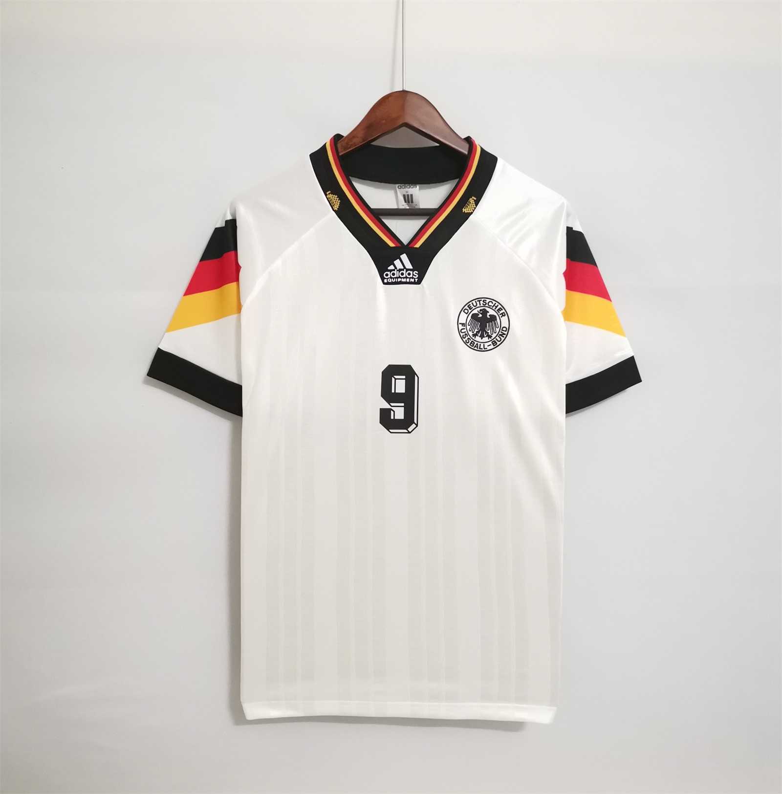 Mens Germany Retro Home Jersey 1992 Mens Germany Retro Home Jersey 1992 front view on hanger showing tricolor shoulder blocks and number 9