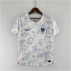 Mens France World Cup Away Jersey 2022 front view on hanger showing Toile de Jouy graphic and royal blue crest