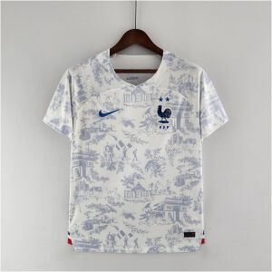 Mens France World Cup Away Jersey 2022 Mens France World Cup Away Jersey 2022 front view on hanger showing Toile de Jouy graphic and royal blue crest