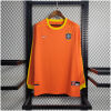 Mens World Cup Brazil s Retro Long Sleeve Goalkeeper Jersey 1998 on hanger showing orange body with yellow cuffs