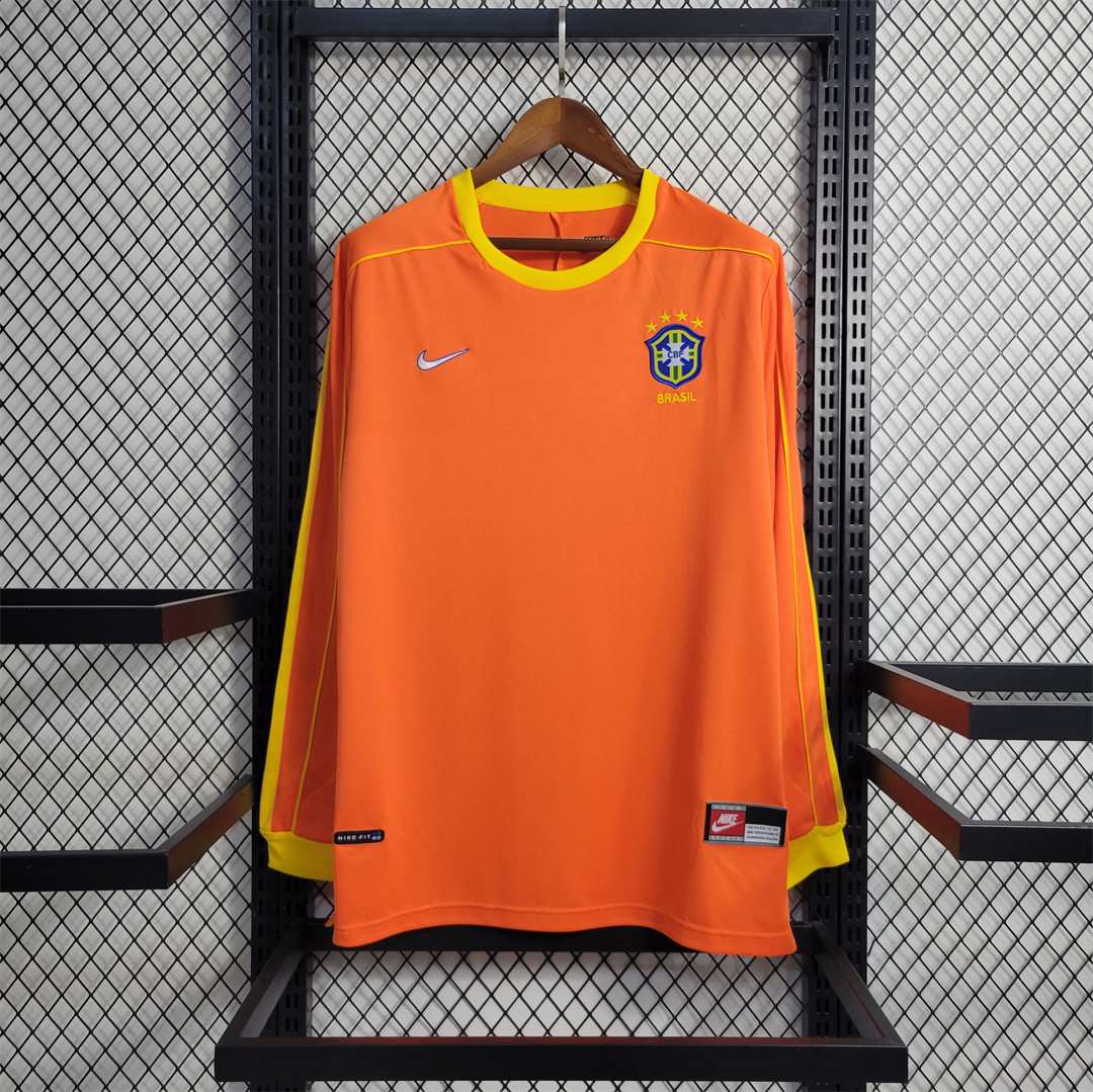 Mens World Cup Brazil s Retro Long Sleeve Goalkeeper Jersey 1998 Mens World Cup Brazil s Retro Long Sleeve Goalkeeper Jersey 1998 on hanger showing orange body with yellow cuffs