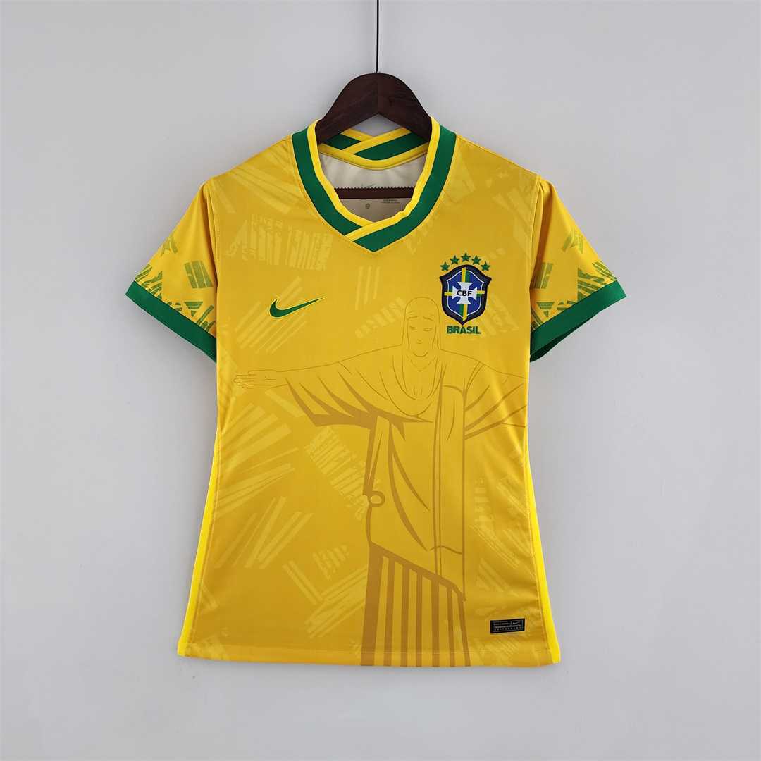 Womens World Cup Brazil classic yellow Jersey 2022 Womens World Cup Brazil classic yellow Jersey 2022 on hanger showing yellow body with Christ statue line art