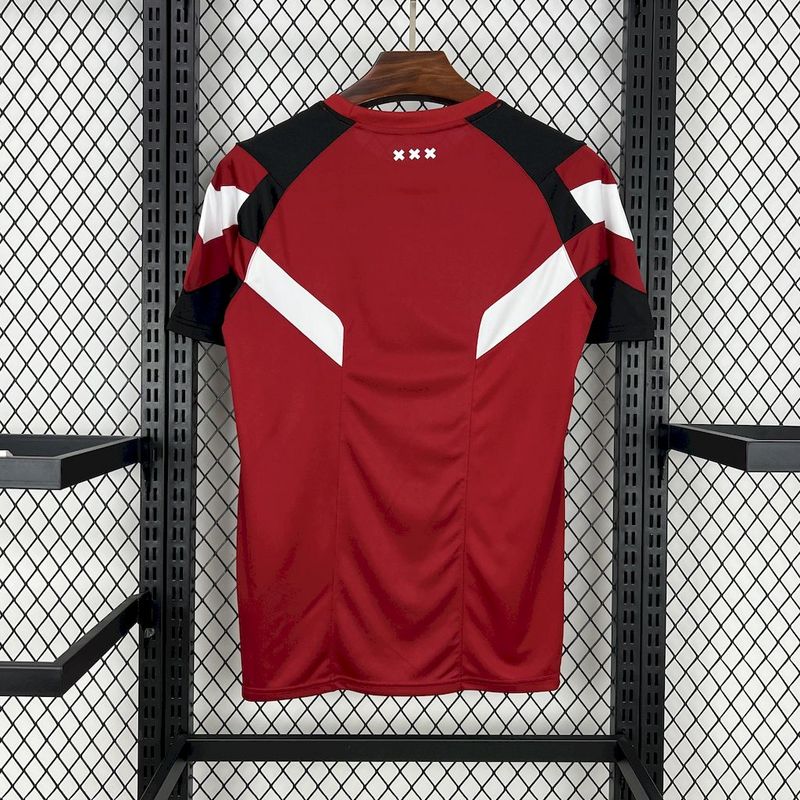 Mens Ajax Red Training Kit Jersey 2024/25 Mens Ajax Red Training Kit Jersey 2024/25 front view on display
