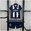 Kids Monterrey Home Kit 2025/26 front view with polo shirt and navy shorts