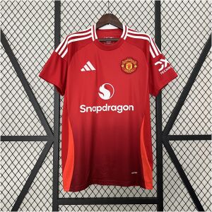 Mens Manchester United Home Jersey 2024/25 on mannequin showing two-tone red gradient body and Snapdragon sponsor