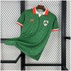 Mens Ireland St. Patrick Day Green Jersey 2025/26 angled on hanger displaying Celtic knot pattern and orange collar