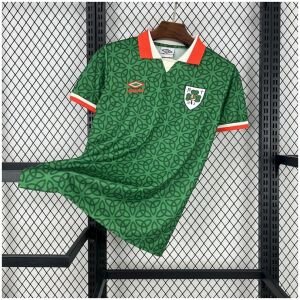 Mens Ireland St. Patrick Day Green Jersey 2025/26 angled on hanger displaying Celtic knot pattern and orange collar