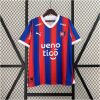 Mens Cerro Porteno Home Jersey 2024/25 on display showing blue and red vertical stripes with white V-neck collar and cuffs