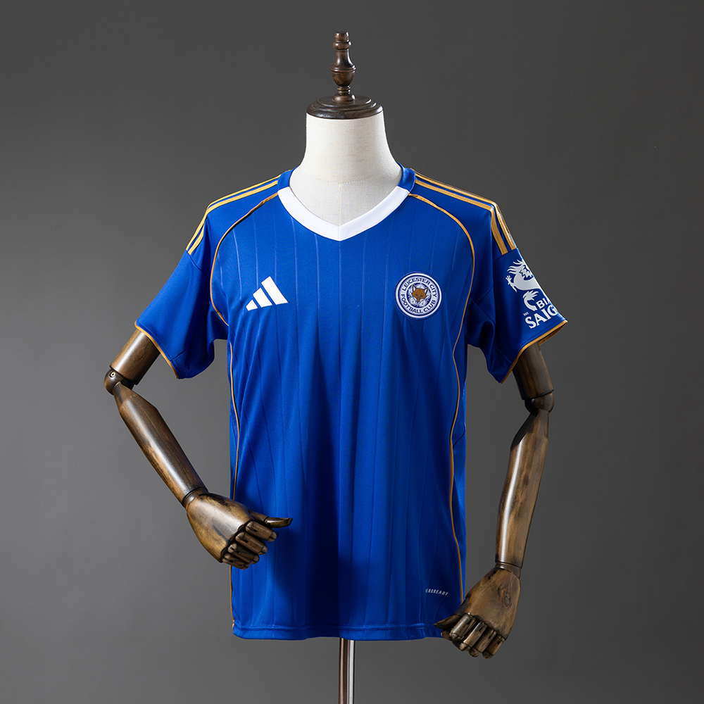 Mens Leicester Game Home Jersey 2025/26 Mens Leicester Game Home Jersey 2025/26 on mannequin showing royal blue body with white V-neck collar and gold trim