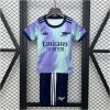 Kids Arsenal Third Kit 2024/25 on display showing lilac and mint gradient jersey with matching dark navy shorts