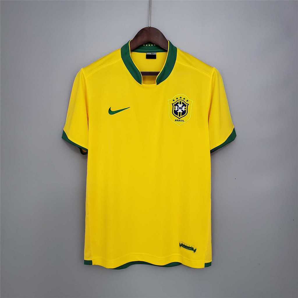 Mens World Cup Brazil Retro Home Jersey 2006 Mens World Cup Brazil Retro Home Jersey 2006 on hanger showing yellow body with green stand collar