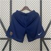 Mens PSG Home Shorts 2024/25 hanging display showing midnight navy knit with embroidered crest and swoosh