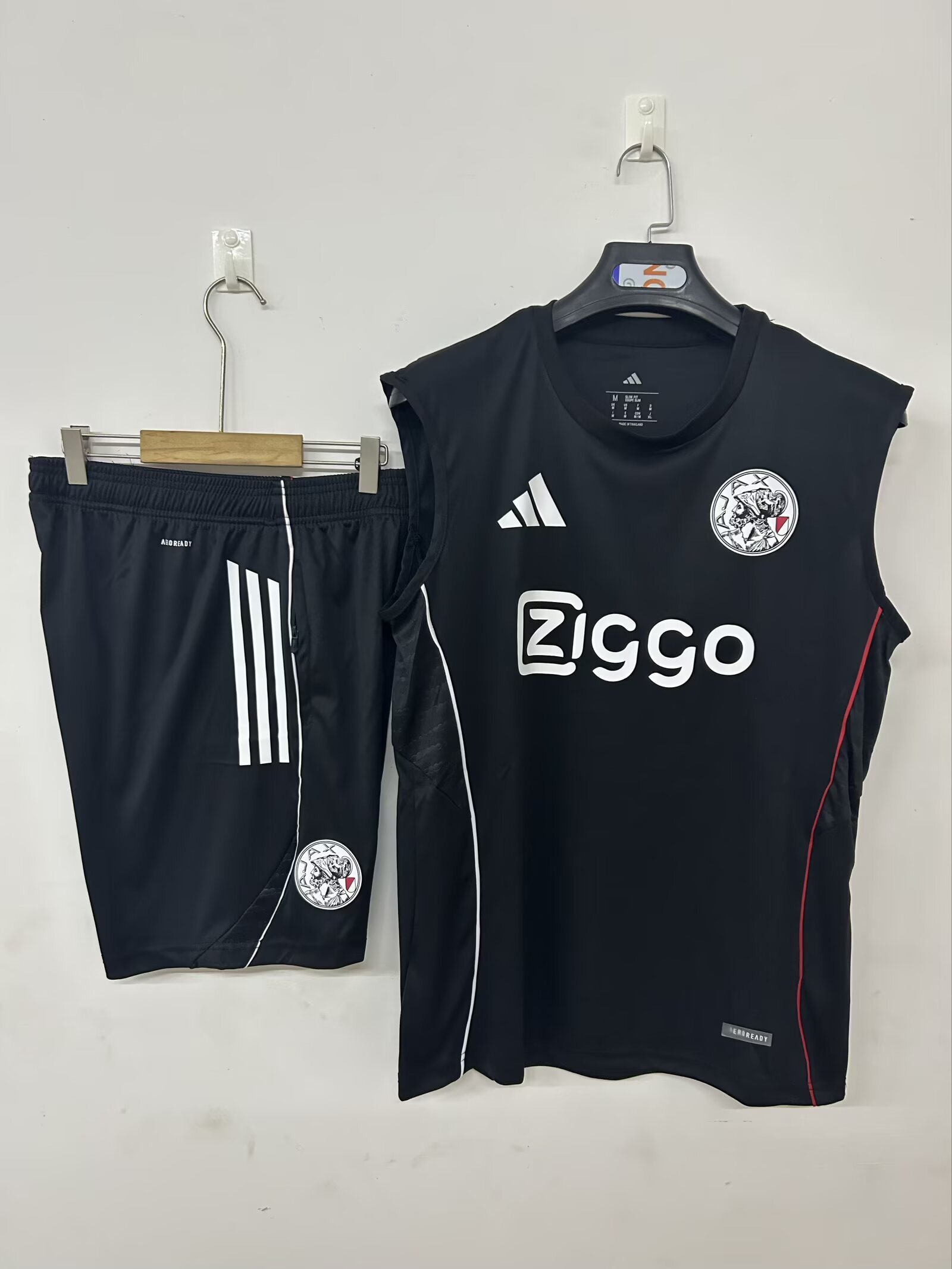 Mens Ajax black Training Kit 2025/26 Mens Ajax black Training Kit Singlet Kits Kit 2025/26 front view on display