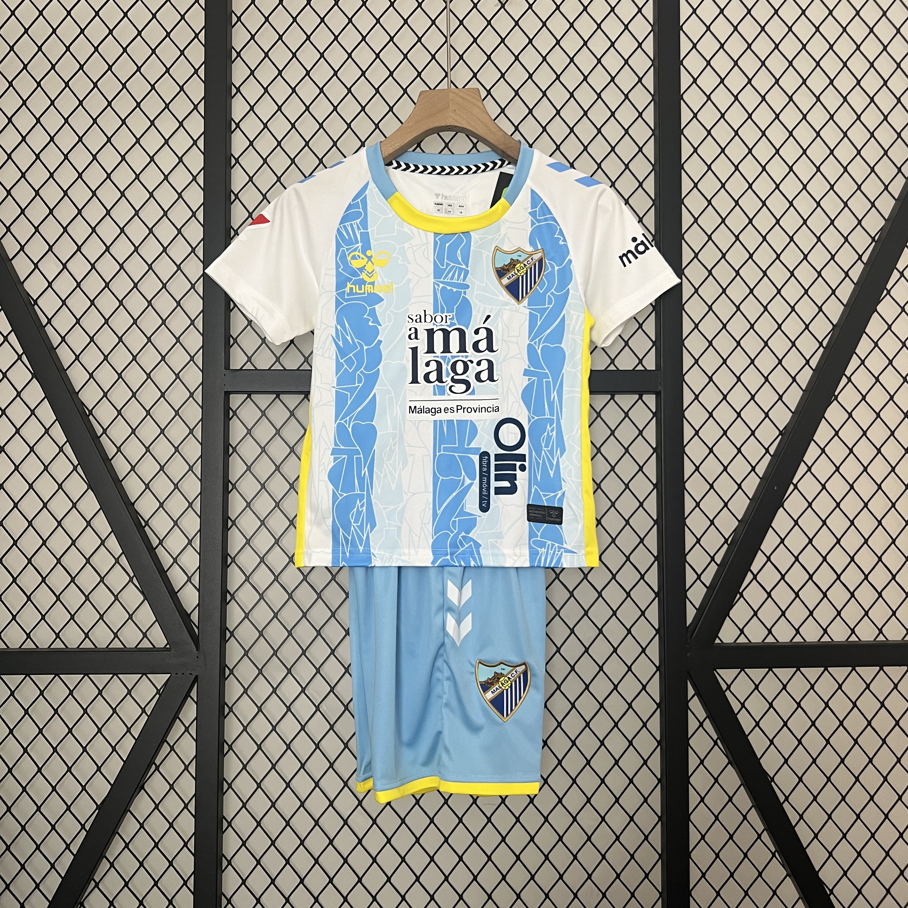 Kids Malaga Home Kit 2024/25 Kids Malaga Home Kit 2024/25 front view on display