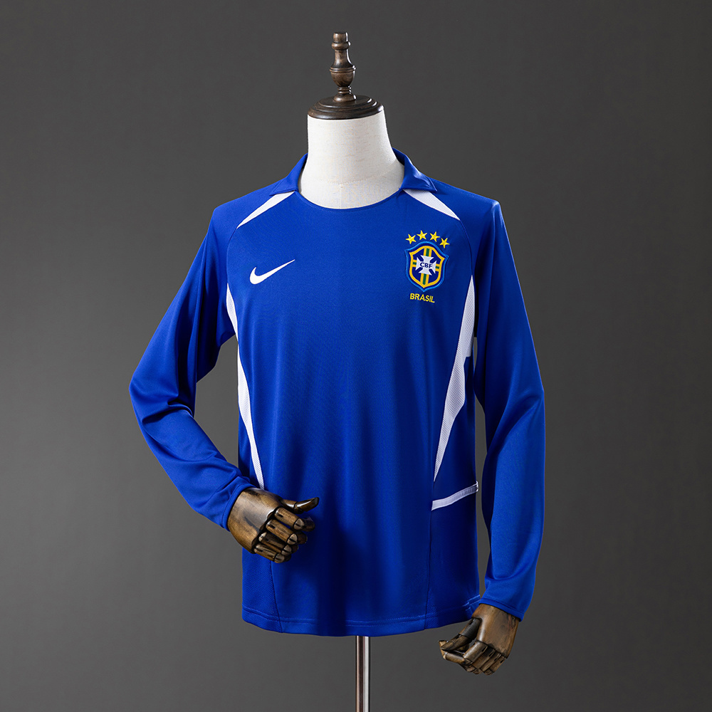 Mens World Cup Brazil Retro Long Sleeve Away Jersey 2002 Mens World Cup Brazil Retro Long Sleeve Away Jersey 2002 front view on mannequin showing cobalt blue long sleeves