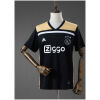 Front view of the Mens Ajax Retro Away Jersey 2018/19 displaying black and gold panels, white Ziggo sponsor, and the Ajax crest on a mannequin.