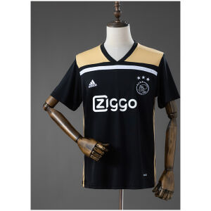 Front view of the Mens Ajax Retro Away Jersey 2018/19 displaying black and gold panels, white Ziggo sponsor, and the Ajax crest on a mannequin.