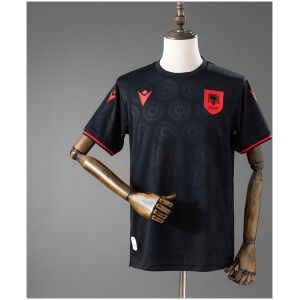 Front display of Mens Albania Third Jersey 2026 in black with tonal rosette pattern and red FSHF badge