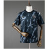 Front view of the Mens Atletico Mineiro Pre-Match Jersey 2026/27 featuring charcoal camouflage graphics and gold accents