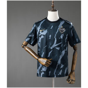 Front view of the Mens Atletico Mineiro Pre-Match Jersey 2026/27 featuring charcoal camouflage graphics and gold accents
