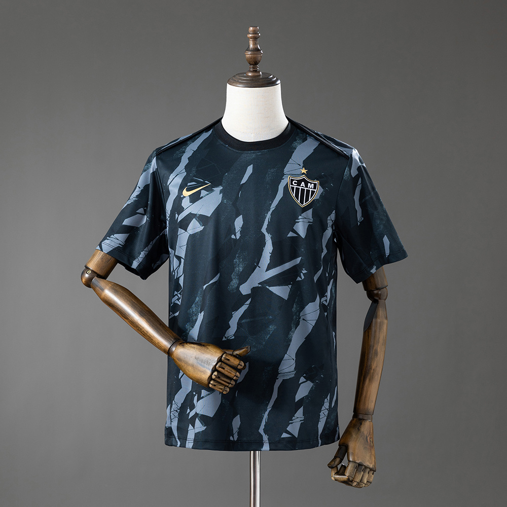 Mens Atletico Mineiro Pre-Match Jersey 2026/27 Front view of the Mens Atletico Mineiro Pre-Match Jersey 2026/27 featuring charcoal camouflage graphics and gold accents