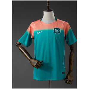 Mens Australia Away Jersey 2026 front view showing coral and teal gradient with Australia crest