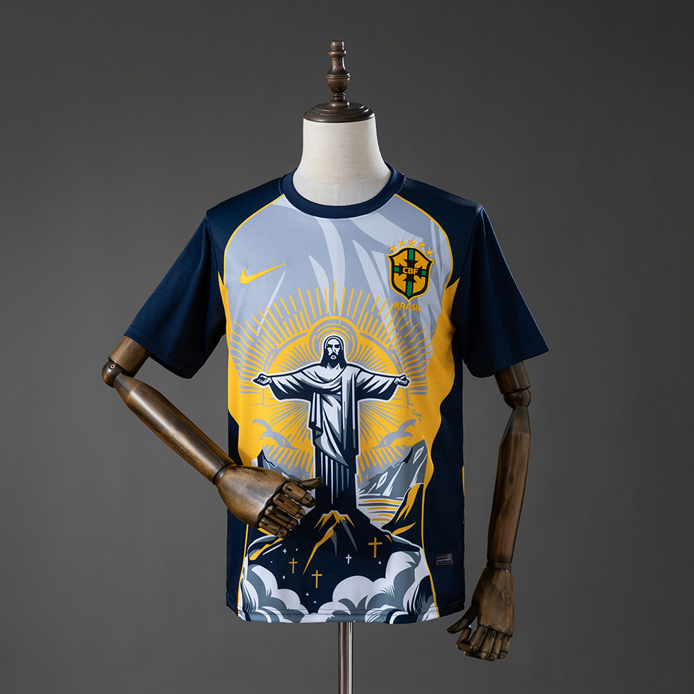 Mens Brazil Christ the Savior – Yellow Jersey 2026 Mens Brazil Christ the Savior – Yellow Jersey 2026 front view with Christ the Redeemer artwork and navy sleeves