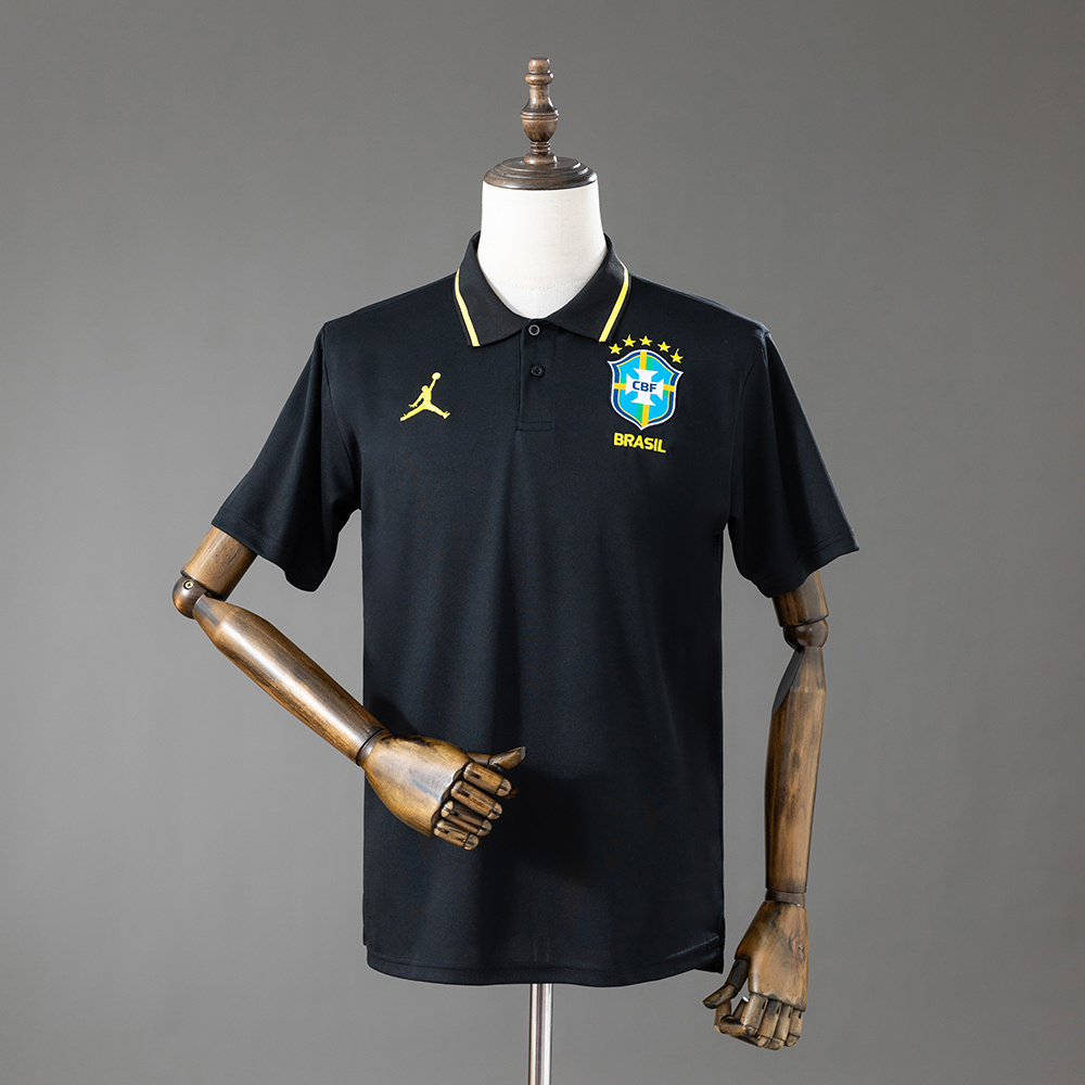 Mens Brazil Black Polo 2026 Front view of the Mens Brazil Black Polo 2026 with yellow collar tipping and embroidered CBF Brazil crest