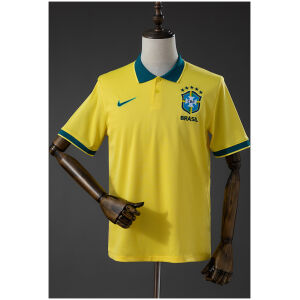 Front view of the Mens Brazil Shirt Polo 2026 in canary yellow with dark green polo collar and embroidered CBF crest on a mannequin.