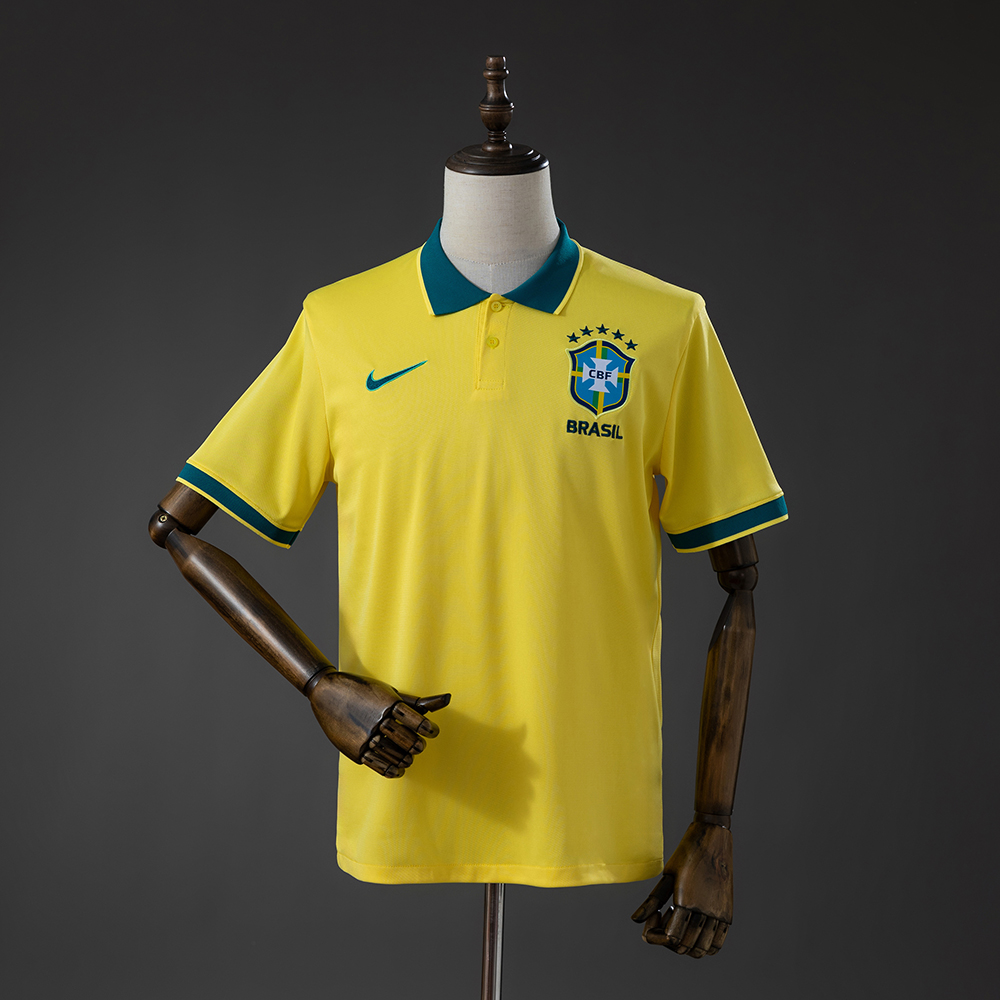 Mens Brazil Shirt Polo 2026 Front view of the Mens Brazil Shirt Polo 2026 in canary yellow with dark green polo collar and embroidered CBF crest on a mannequin.