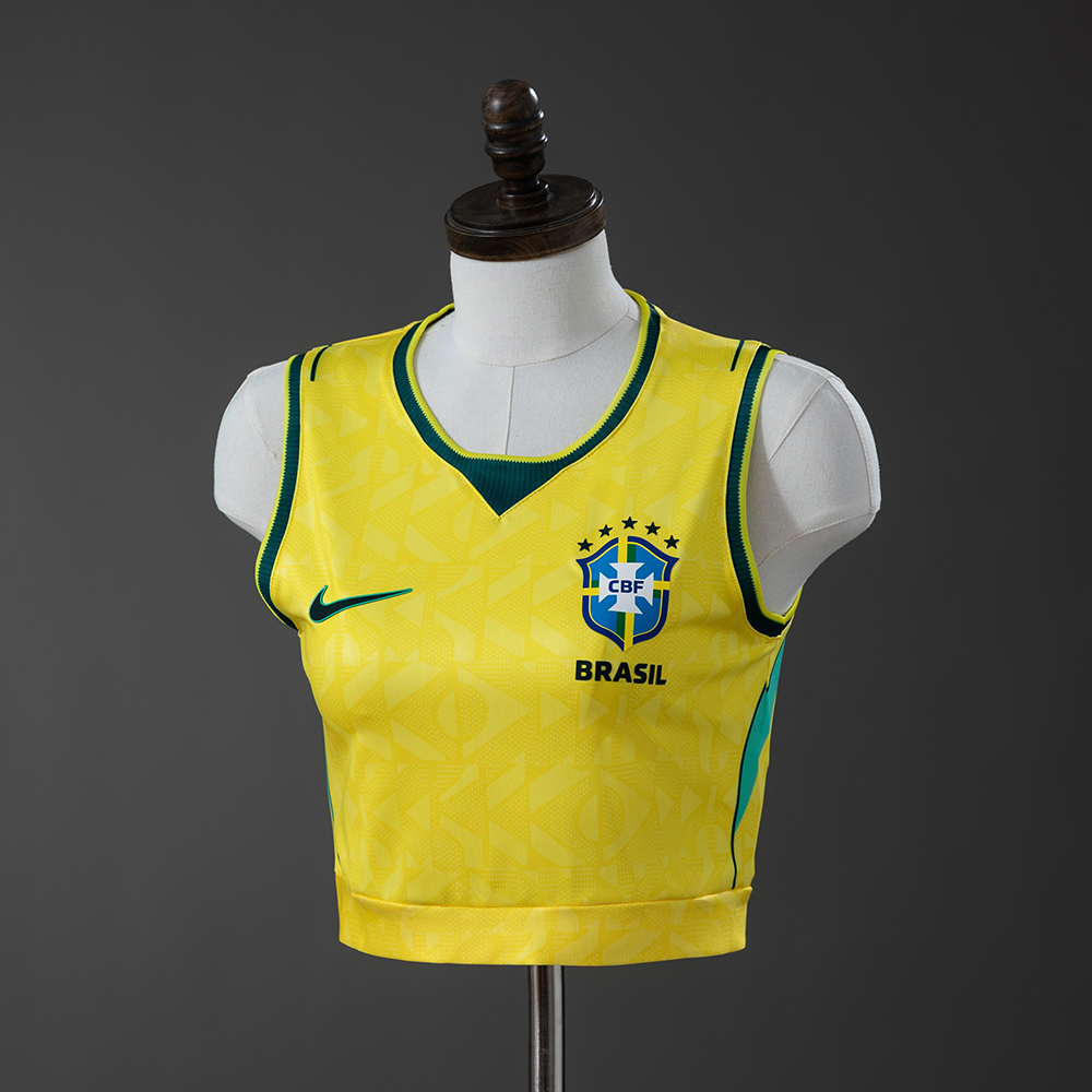 Womens Brazil Crop Tank Top Home Jersey 2026 Front view of Womens Brazil Crop Tank Top Home Jersey 2026 in yellow with green trim on mannequin