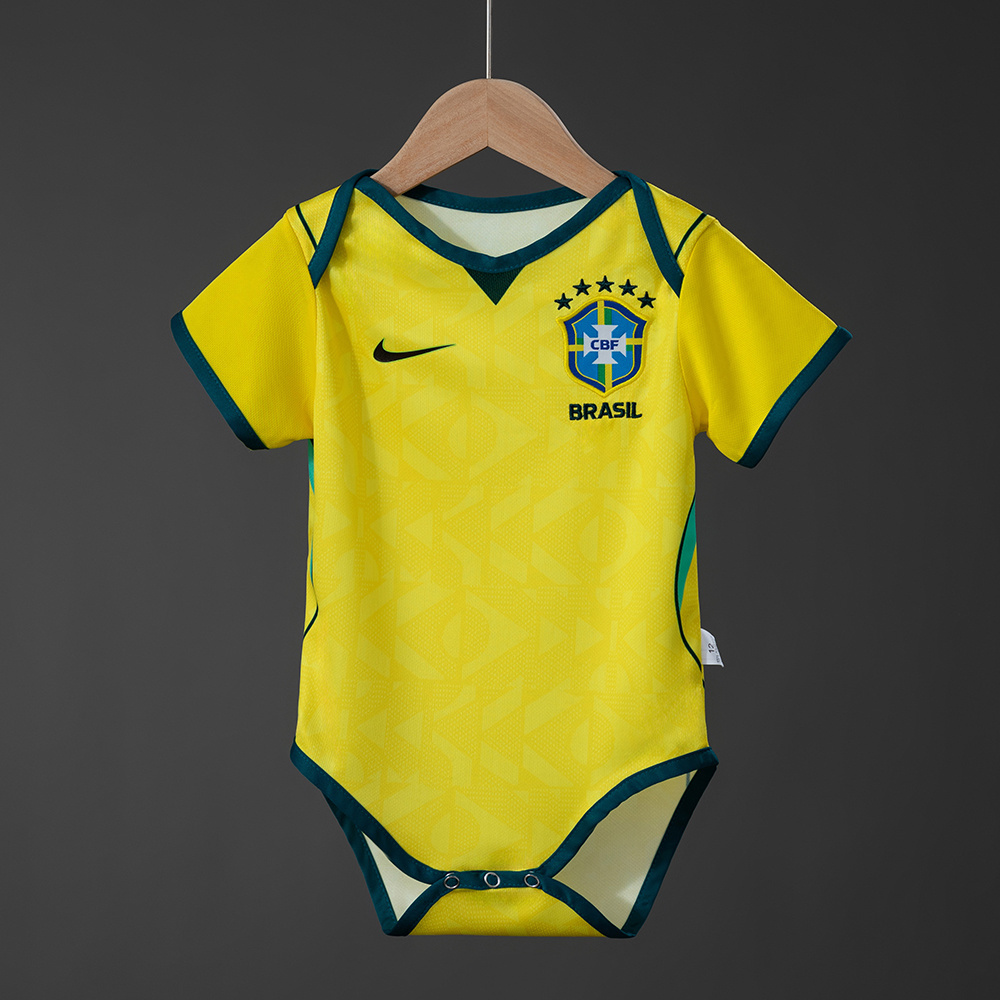 Baby Brazil Home Jersey 2026 Baby Brazil Home Jersey 2026 yellow infant bodysuit on hanger front view