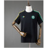 Front view of the Mens Celtic Travel Shirt Away Jersey 2026/27 in black with green and yellow shoulder stripes