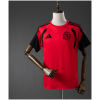 Front view of the Mens Colo Colo Red Training Kit Jersey 2026/27 in red with black raglan sleeves