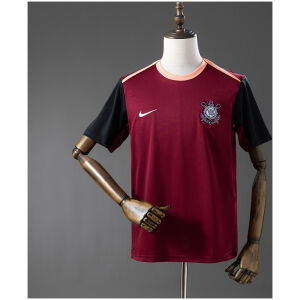 Mens Corinthians Training Kit Jersey 2026/27 Front view of the Mens Corinthians Training Kit Jersey 2026/27 in burgundy with black sleeves and peach trim