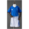 Front view of the Kids Cruzeiro Home Kit 2026 showing royal blue V-neck jersey and matching white shorts