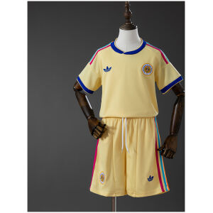 Front view of the Kids Curacao Away Kit 2026 showcasing pastel yellow fabric, colorful shoulder stripes, and matching yellow shorts on a mannequin.