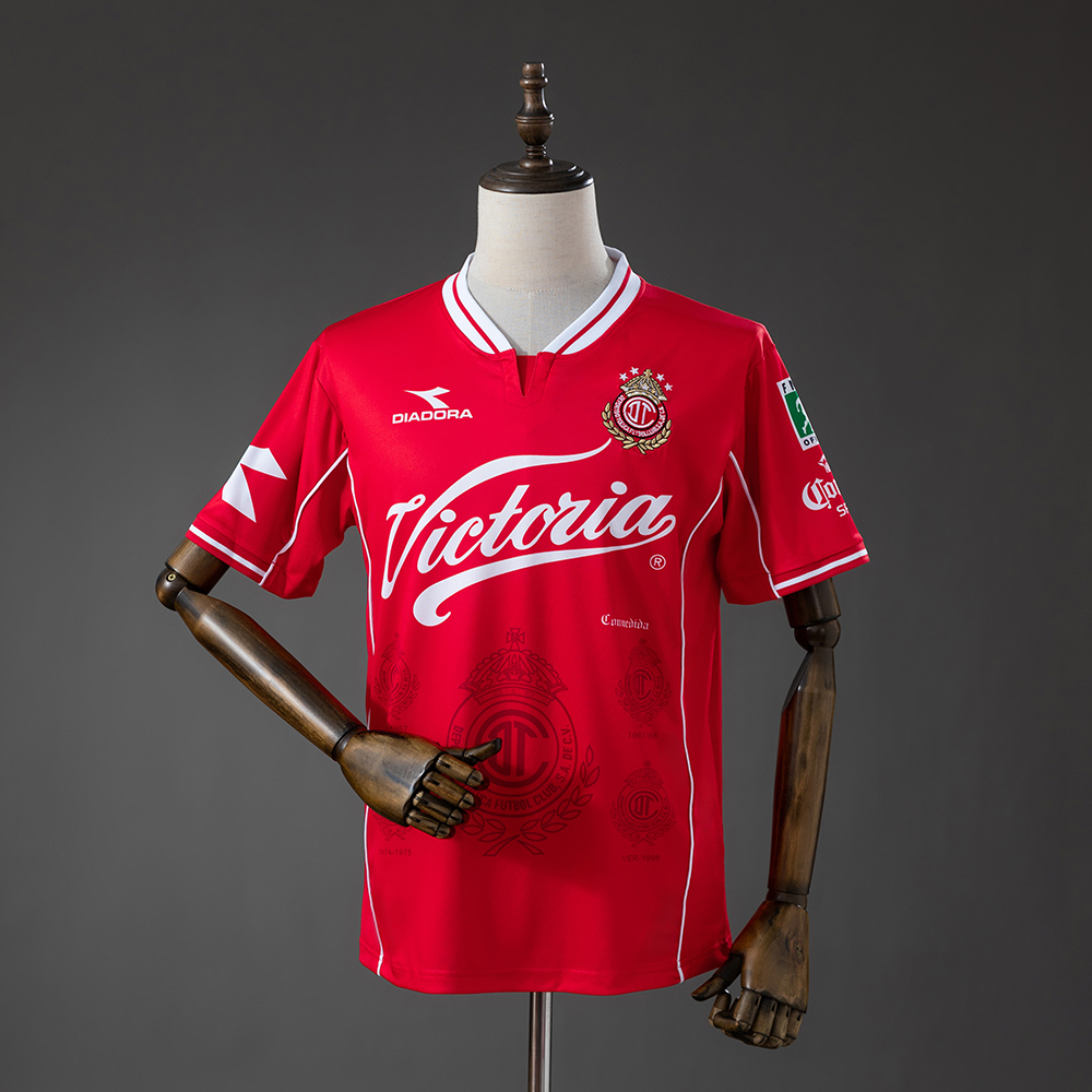 Mens Deportivo Toluca Retro Home Jersey 1998/99 Mens Deportivo Toluca Retro Home Jersey 1998/99 front view in red with Victoria script sponsor and crowned crest