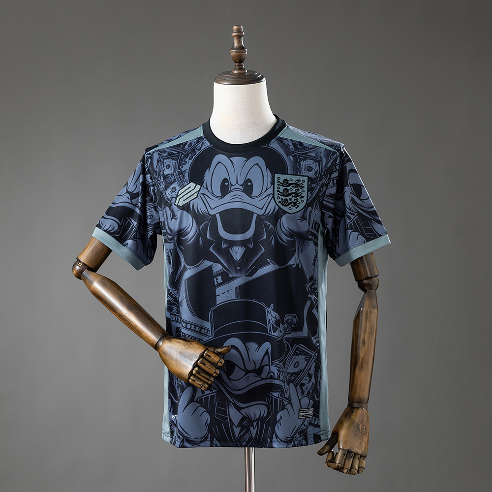 Mens England Donald Duck Edition Jersey 2026/27 Mens England Donald Duck Edition Jersey 2026/27 front view with Donald Duck comic graphic and Three Lions crest