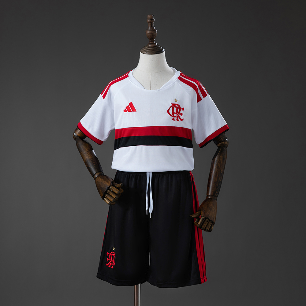 Kids Flamengo Away Kit 2026/27 Kids Flamengo Away Kit 2026/27 front view showing white jersey with red and black chest stripes and black shorts