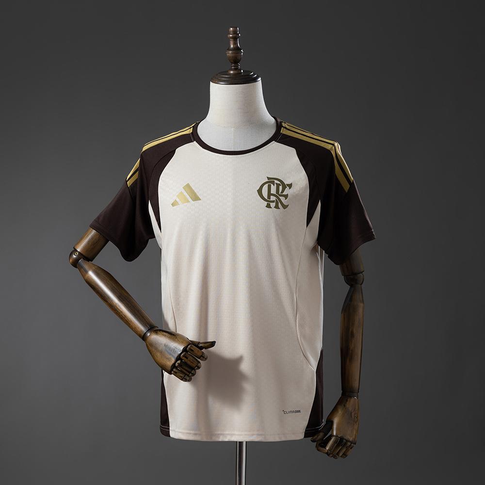 Mens Flamengo Training Kit Jersey 2026/27 Front view of the Mens Flamengo Training Kit Jersey 2026/27 in apricot cream and espresso brown with gold stripes