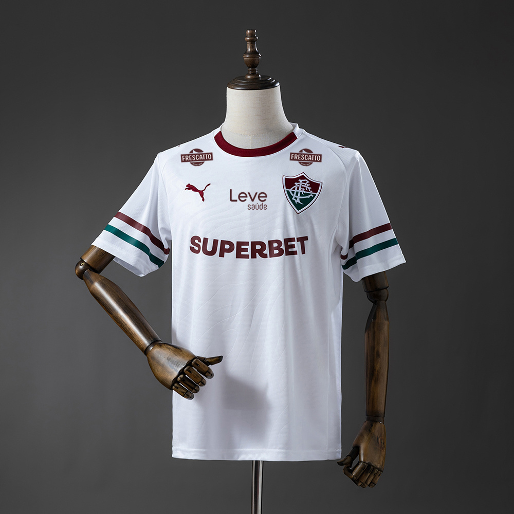 Mens Fluminense Sponsor Away Jersey 2026/27 Front view of the Mens Fluminense Sponsor Away Jersey 2026/27 in white with garnet sponsors and tricolor cuffs