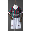 Front view of the Kids Fluminense Home Kit 2026/27 featuring vertical tricolor stripes and white shorts