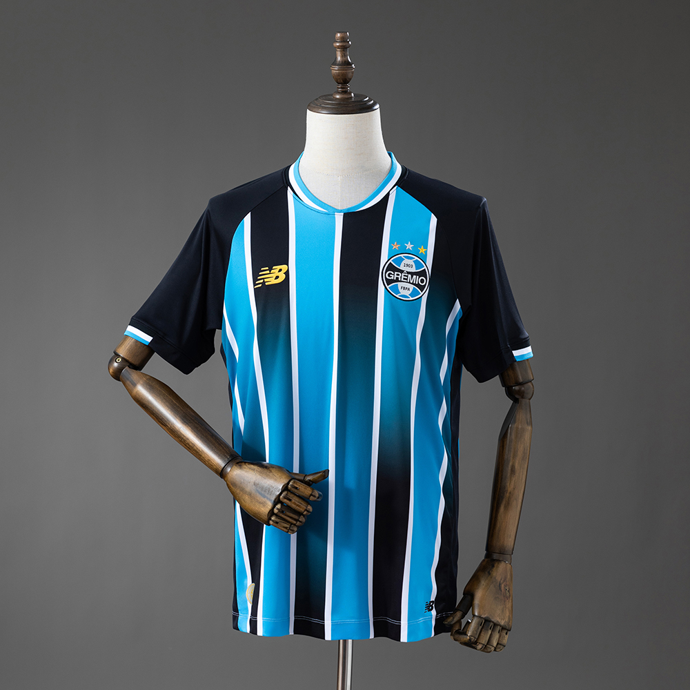 Mens Gremio Home Jersey 2026/27 Mens Gremio Home Jersey 2026/27 front view showing blue, black, and white tricolor stripes and club crest