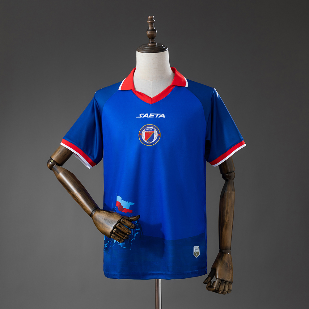 Mens Haiti Home Jersey 2026 Mens Haiti Home Jersey 2026 front view in royal blue with red winged collar and centered FHF crest
