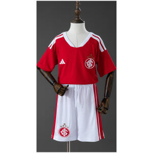 Kids Internacional Home Kit 2026/27 Front view of the Kids Internacional Home Kit 2026/27 including red home shirt and matching white shorts
