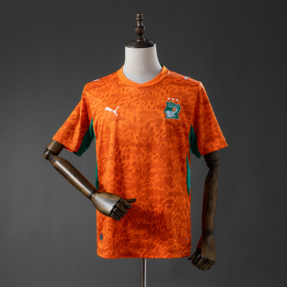 Mens Ivory Home Jersey 2026 Mens Ivory Coast orange home jersey with animal-print pattern front view