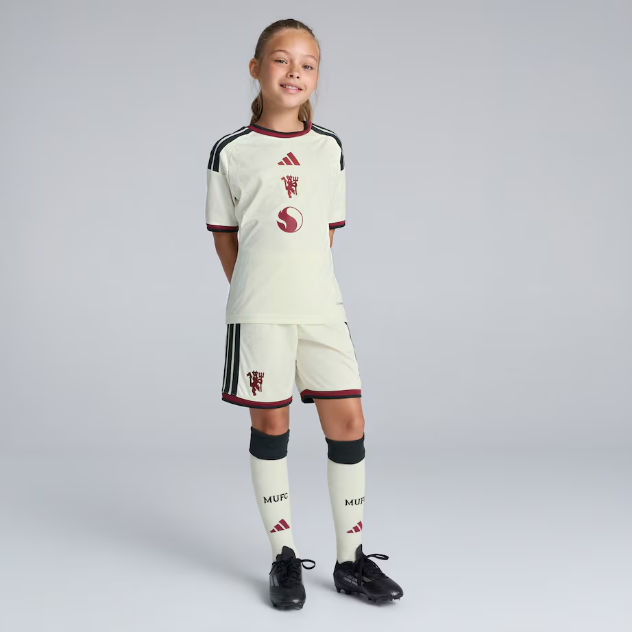 Kids Manchester United Third Jersey Kit 2026/27 Kids Manchester United third kit cream shirt with dark red trim front view