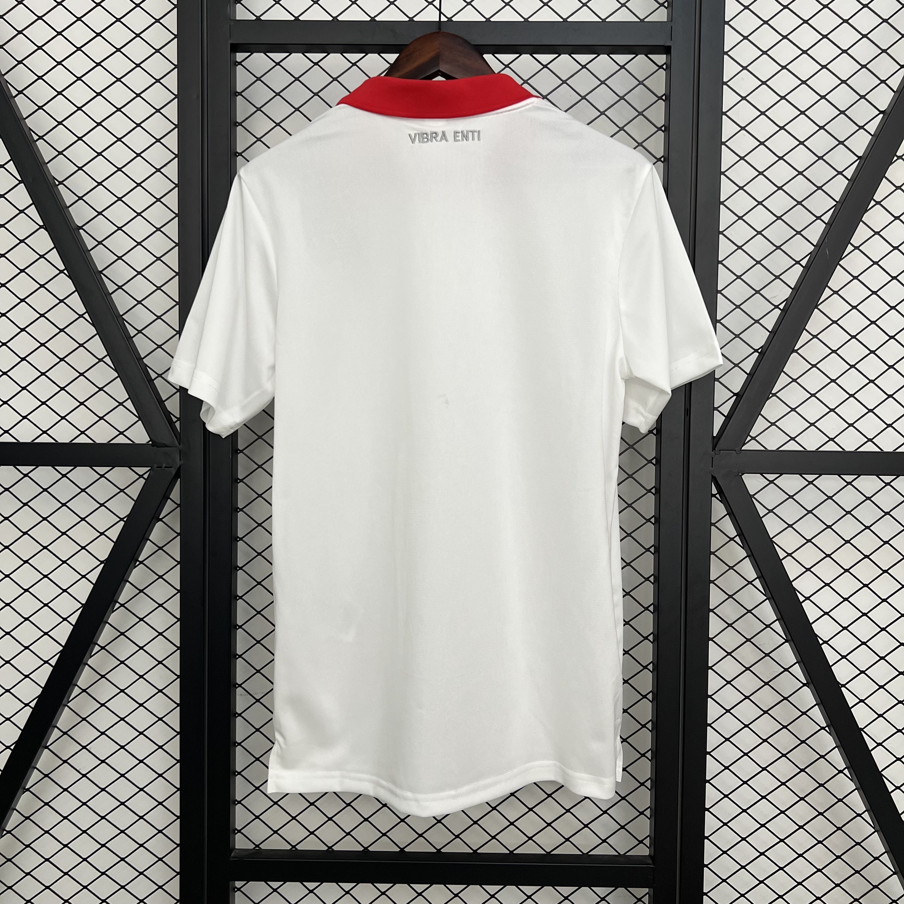 Mens Osasuna White Polo 2025/26 Mens Osasuna White Polo 2025/26 rear view showing tailored white back and silver VIBRA ENTI embroidery
